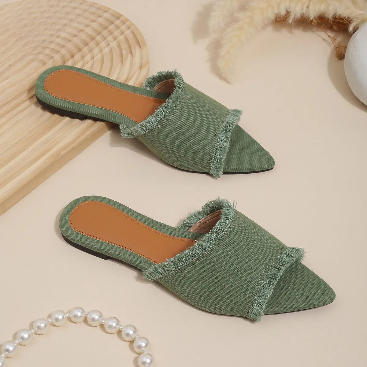Women's denim flat slippers with tassel detail and leather lining in multiple colour options