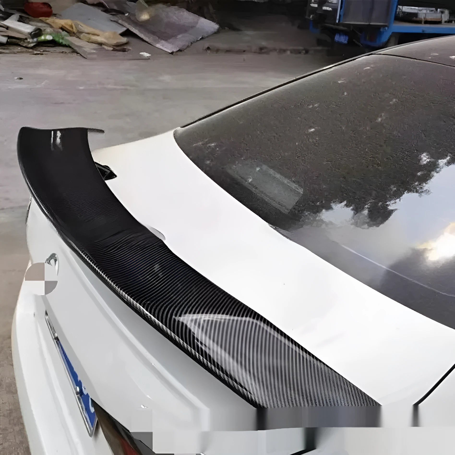Universal punch-free ABS plastic car spoiler tail wing in bright black finish.