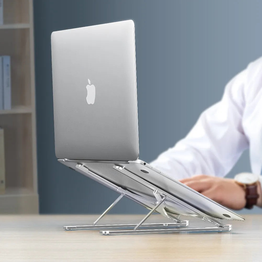 Foldable aluminium laptop stand in silver showing adjustable height mechanism and compact folded size