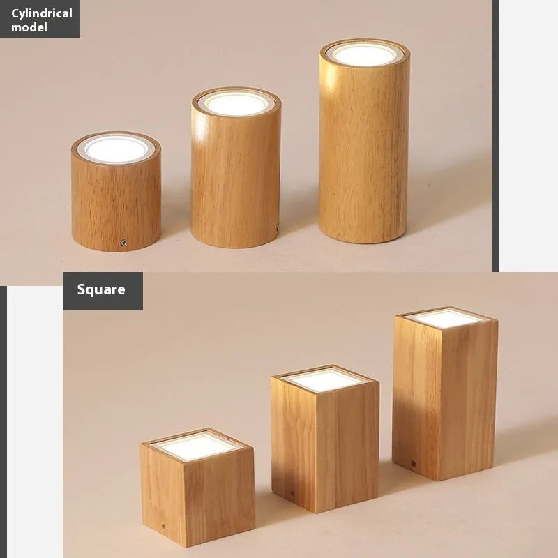 Modern solid wood surface mounted downlight in wood colour, shown in round and square designs for corridor or entrance ceilings.