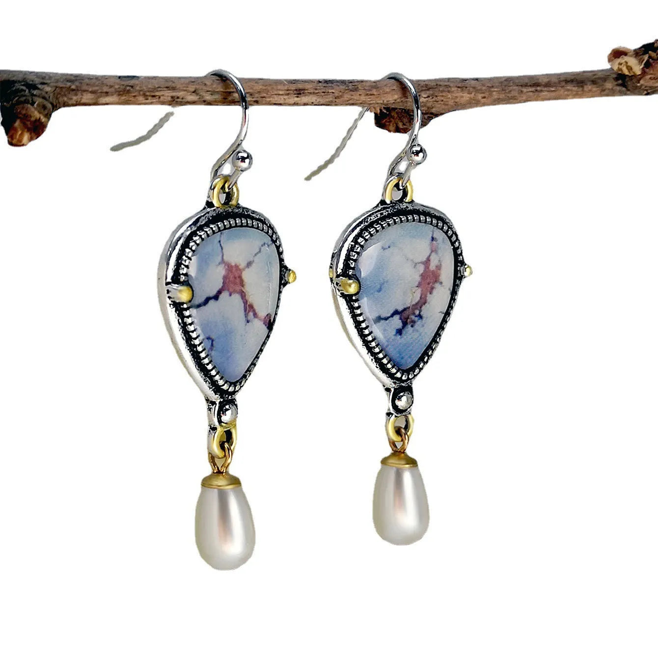Retro blue Bohemian style drop earrings with geometric metal design, synthetic blue opal and white pearl elements