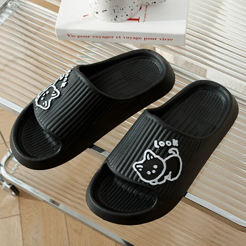 Women's green cat slippers with thick EVA platform sole on a wooden floor