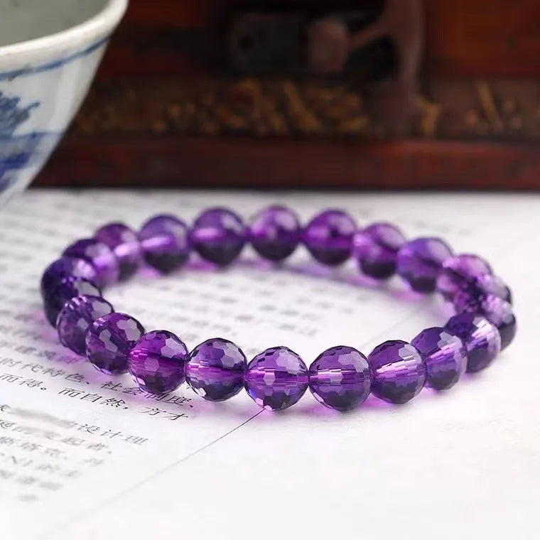 Close-up of a 128-facet cut crystal ametrine bracelet with detailed bead modelling on a wrist.