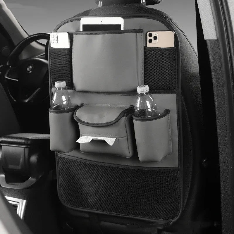 Black leather car seat back storage bag hanging from a headrest