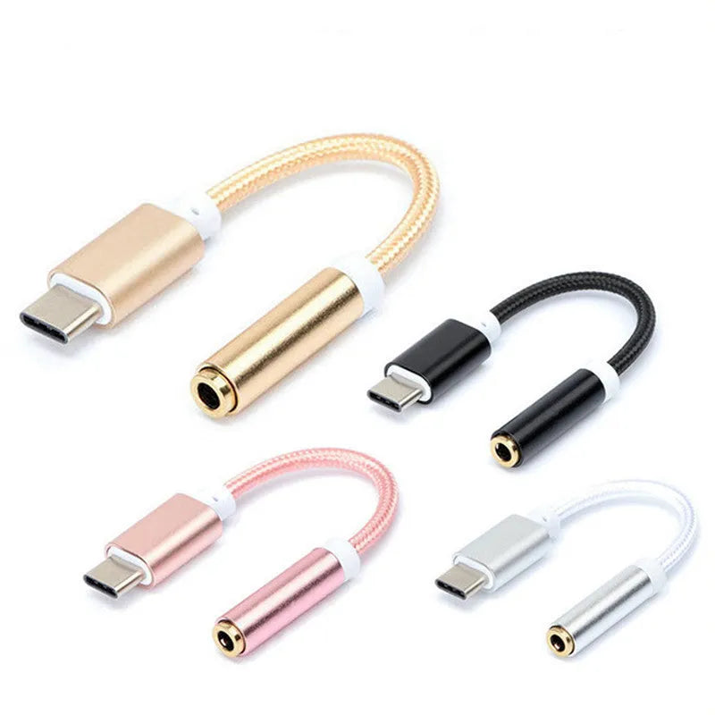 Close-up of a short black nylon Type-C to 3.5mm female headphone adapter cable.