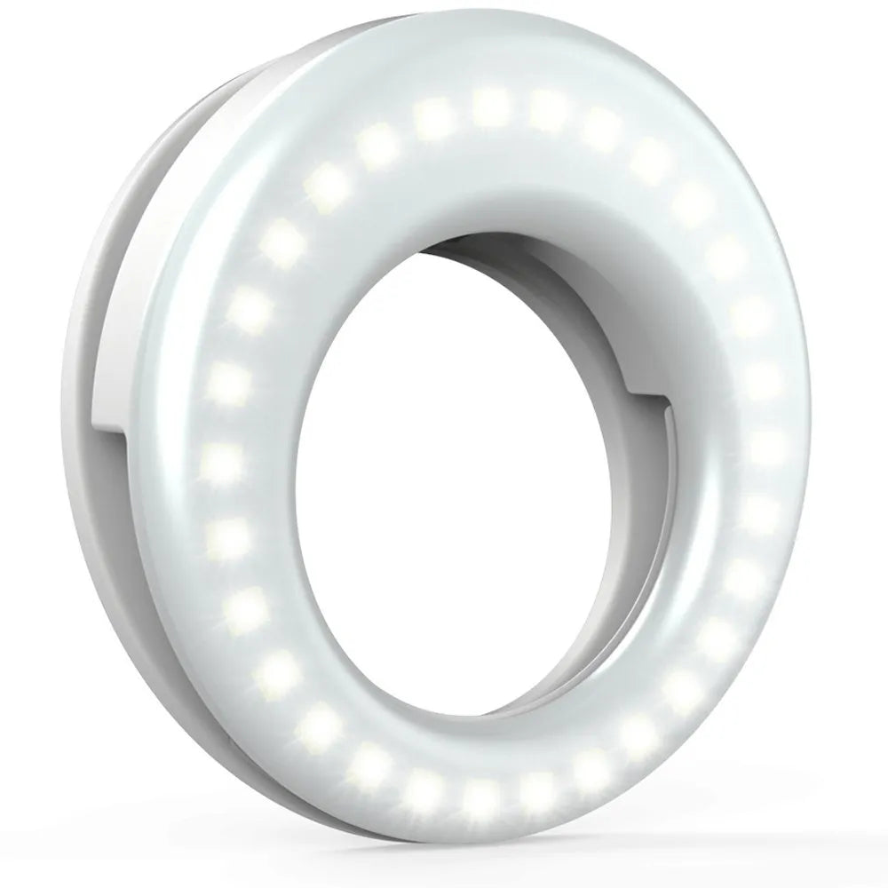 Black USB-rechargeable LED selfie ring light for mobile phone photography on a table.