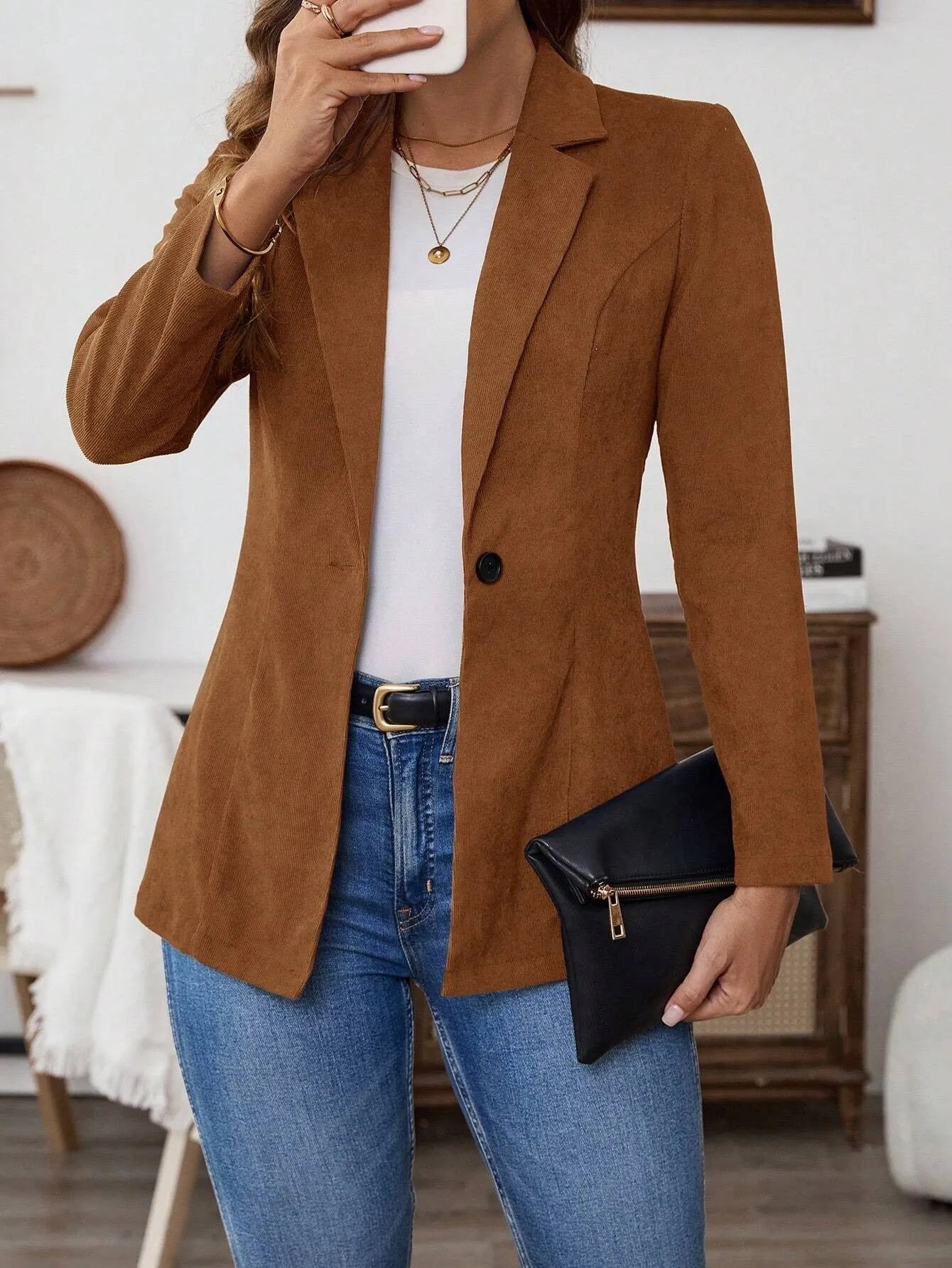 Brown lapel long sleeve single-breasted suit coat on a hanger