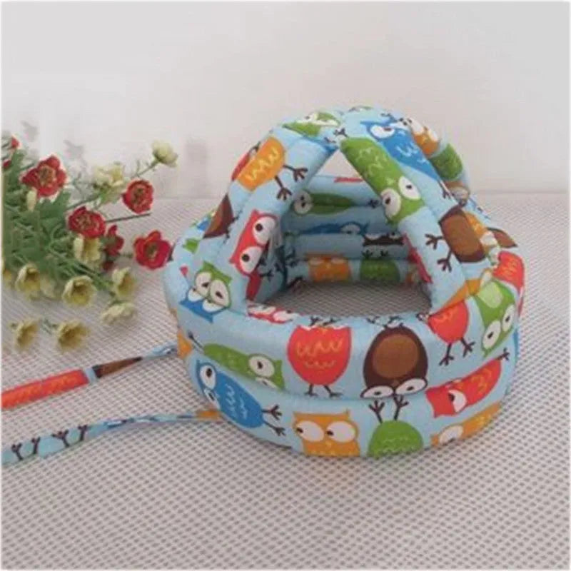 Baby anti collision hat with high-density sponge padding, adjustable headband, breathable cotton outer, colourful design