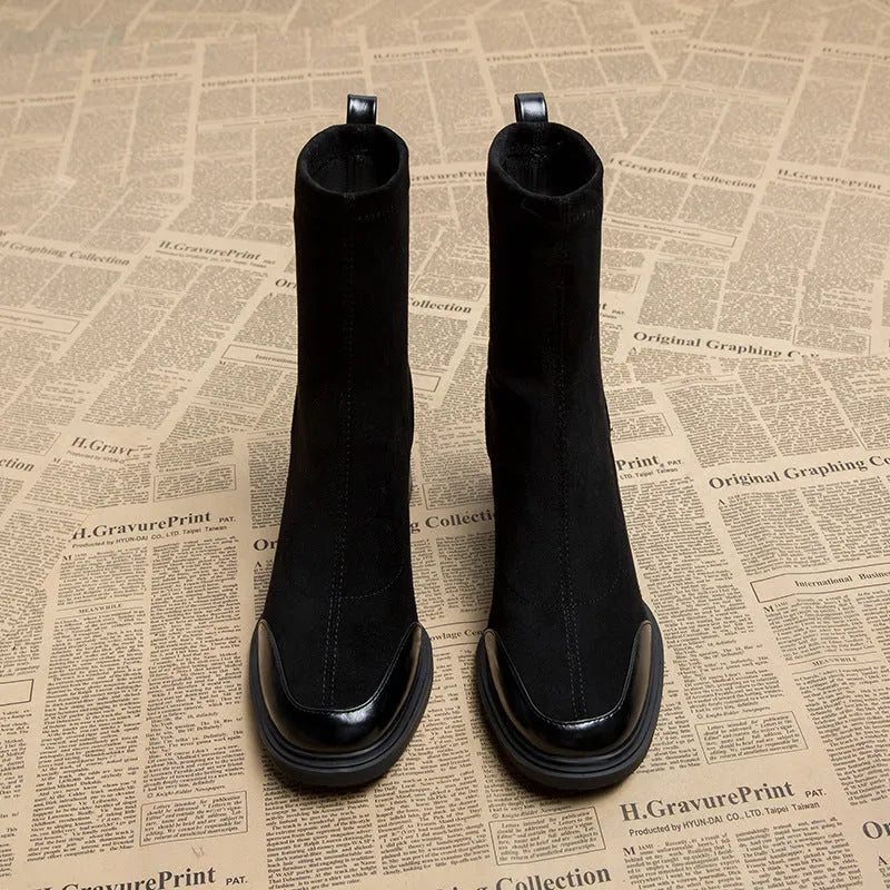 Genuine leather women's short martin boots in black matte finish with high heel and rubber sole