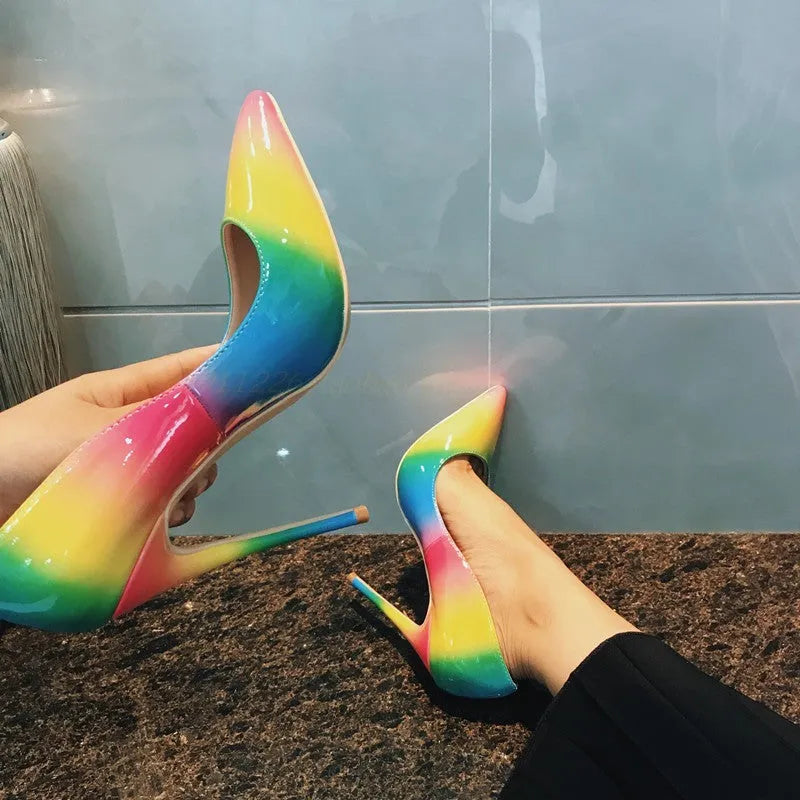Rainbow coloured patent leather pointed toe high heels with thin ultra-high heel.