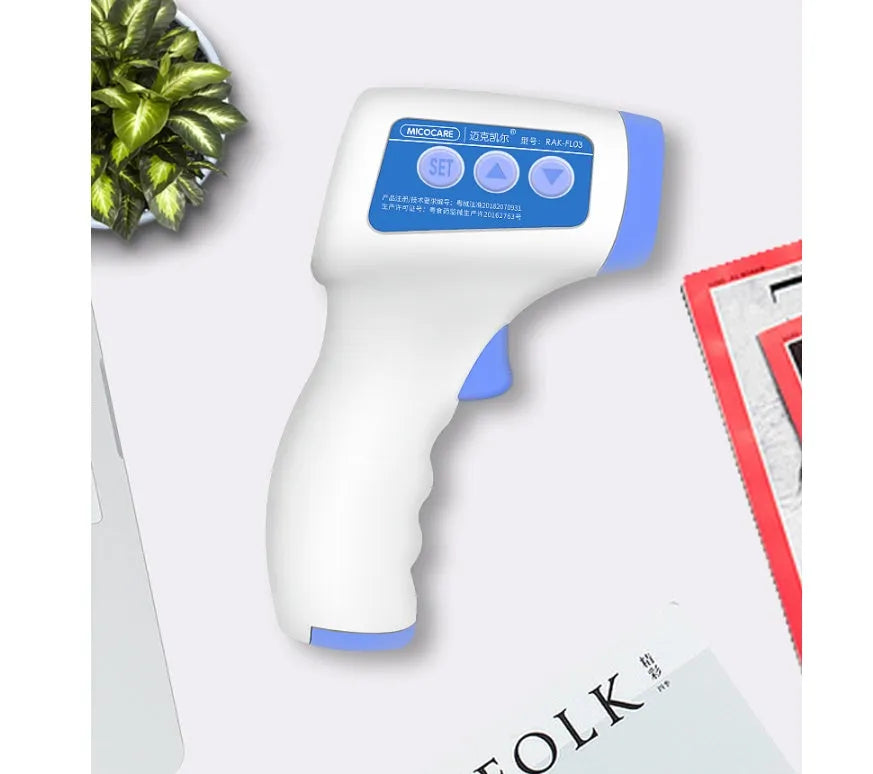 White non-contact infrared forehead thermometer on a blue background with LCD screen