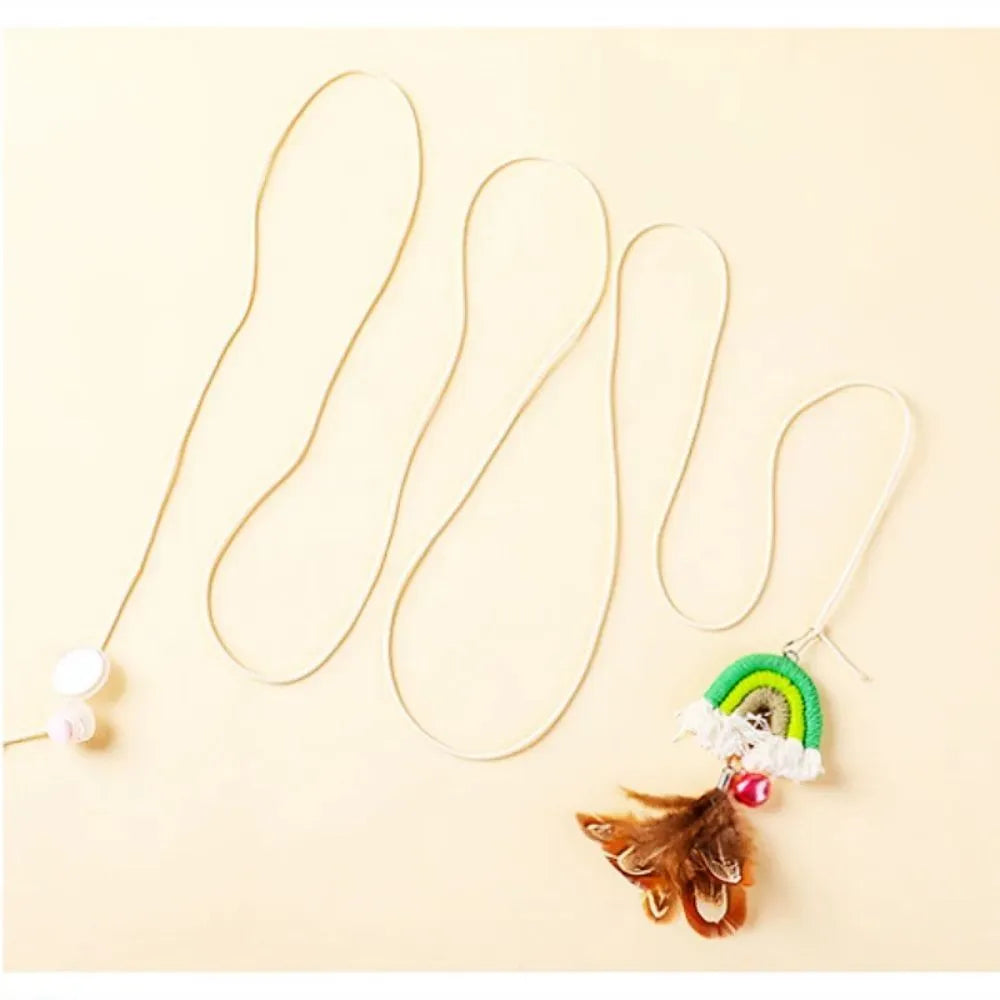 Blue feather cat toy hanging from door with elastic rope and sticky buckle clamp for interactive play