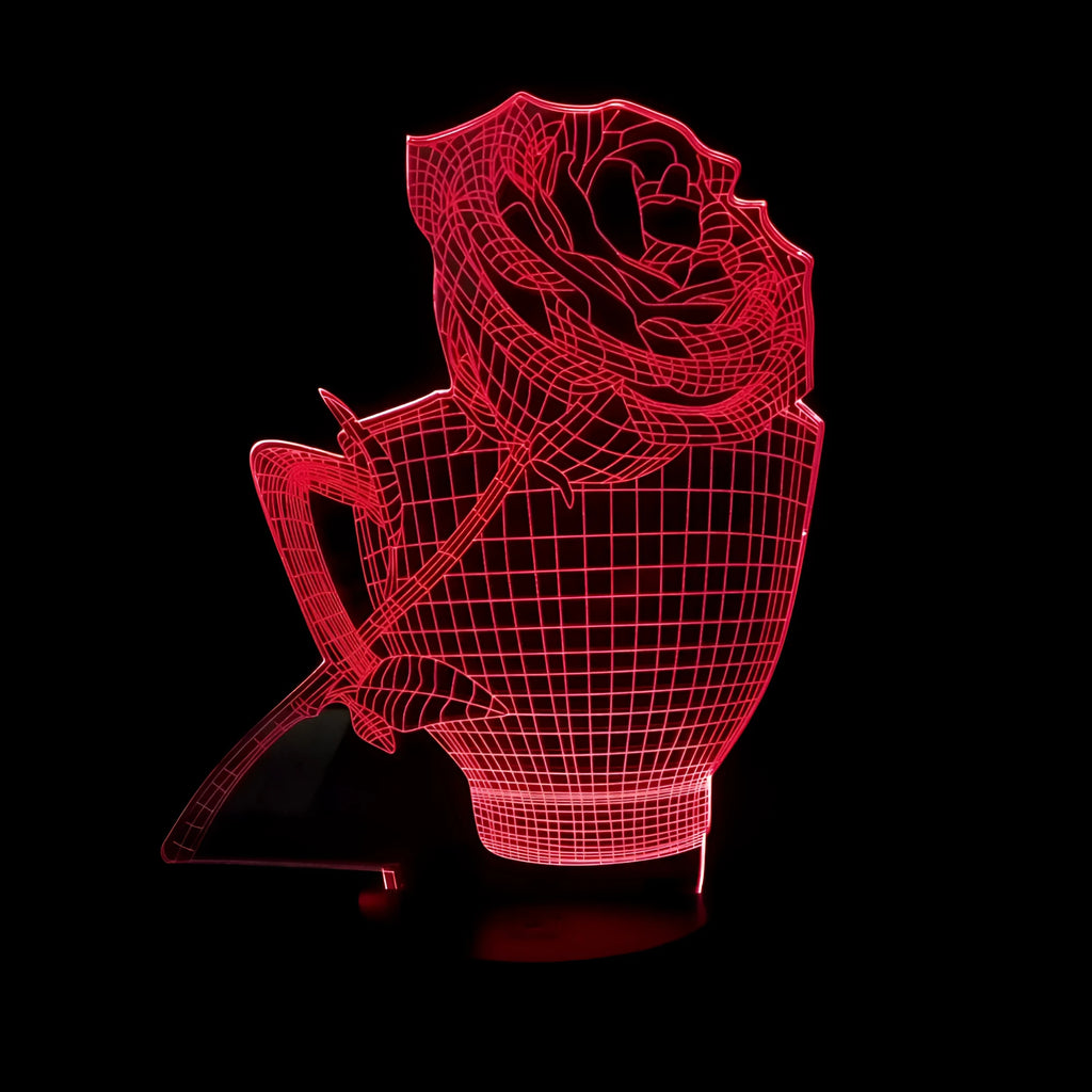 3D rose flower shaped night light with remote control on a table.