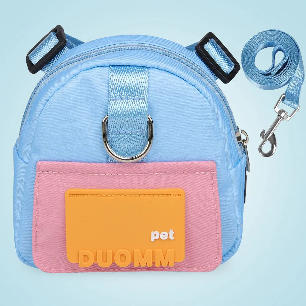 Blue adjustable dog harness with integrated backpack and attached tow rope on a medium-sized dog