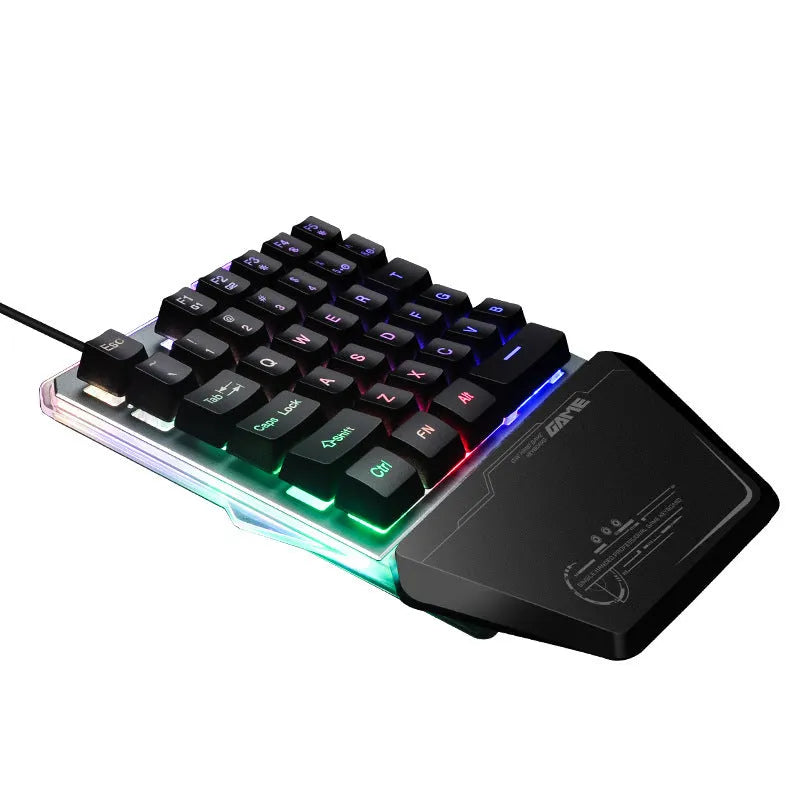 Black robotic one-handed gaming keyboard with RGB backlighting and USB cable
