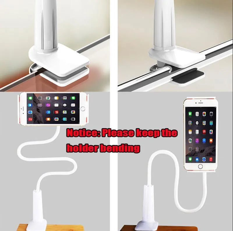 Black bedside phone holder with a long metal arm and adjustable plastic head gripping a mobile phone.