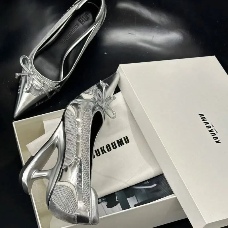 Women's black pointed toe Mary Jane shoes with shaped floating heel and microfiber leather upper on display