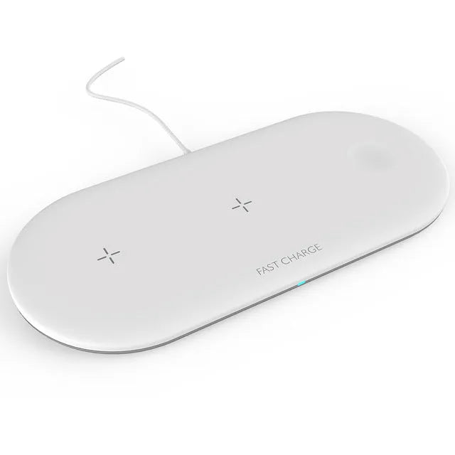 Black and white 3-in-1 wireless charging station for iPhone, Apple Watch and AirPods on a desk.