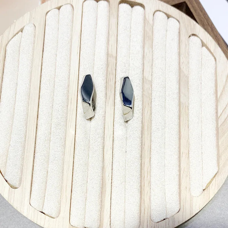 Irregular C-shaped metal stud earrings in Gold finish, minimalist design for everyday wear.