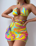 Yellow striped halter neck swimsuit with front lace-up detail, worn with matching skirt and shorts.