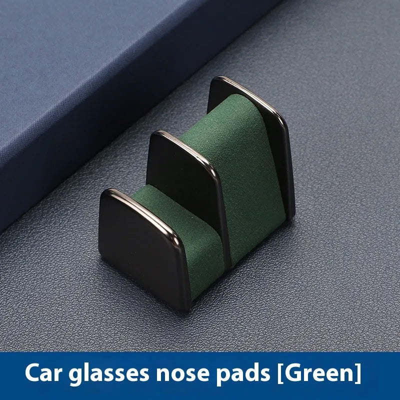 Compact zinc alloy and leather glasses clip for car dashboard, shown in available colours.
