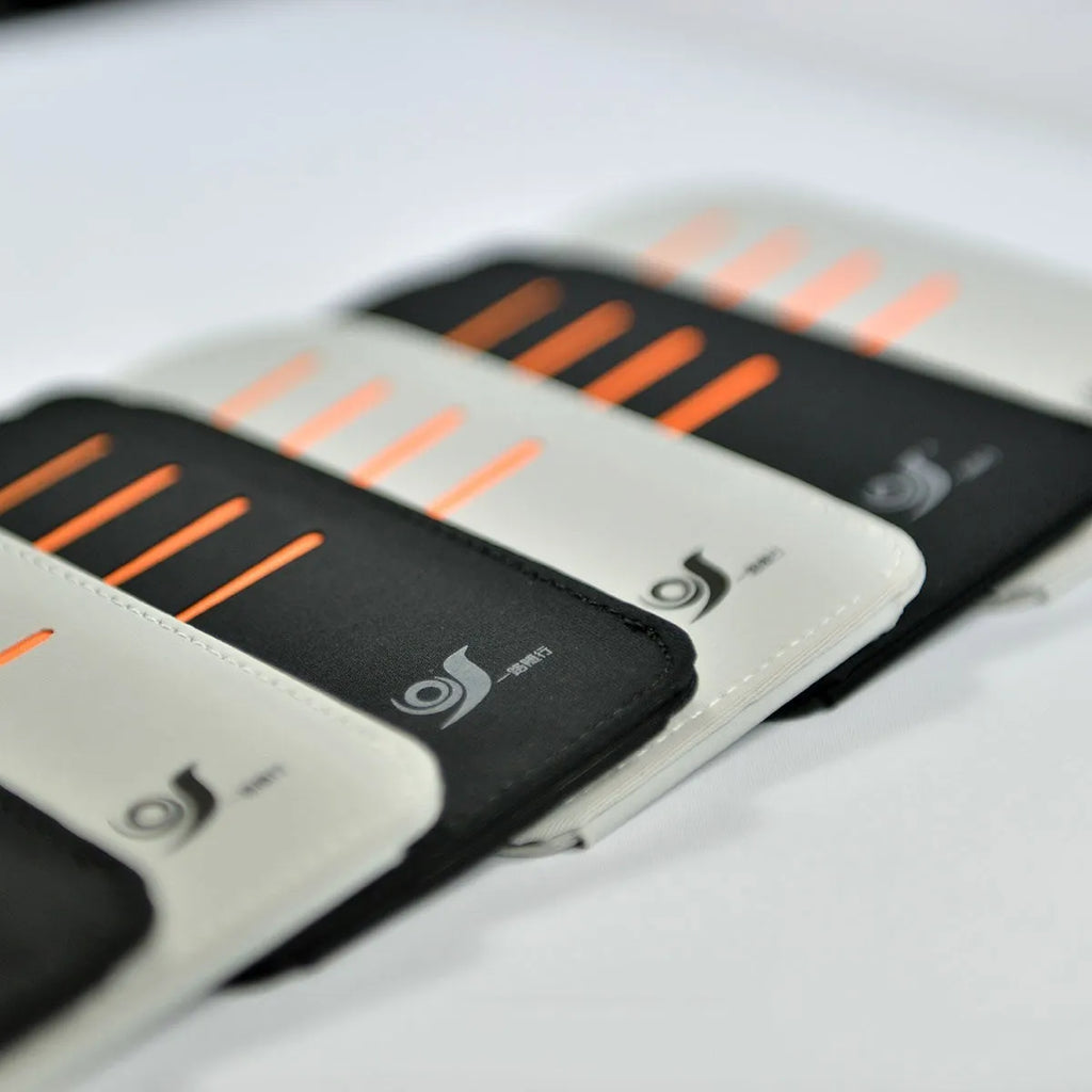 Set of four grey car sun visor card holder tablets next to a vehicle-mounted storage bag.