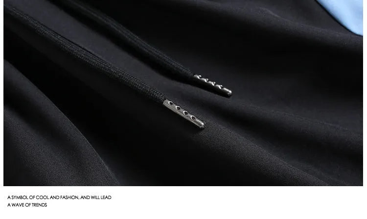 Black and grey quick-drying sports shorts with elastic waistband and loose straight-leg design