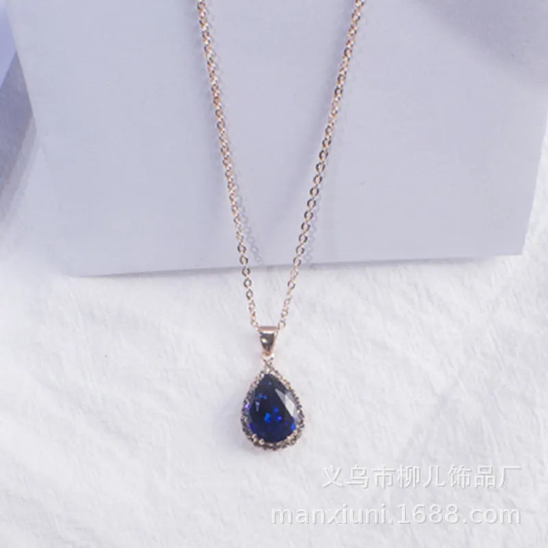 Women's pink rhinestone drop necklace with rose gold electroplated finish and geometric design