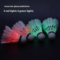 Luminous badminton shuttlecock with green glow, nylon construction, lying on court surface