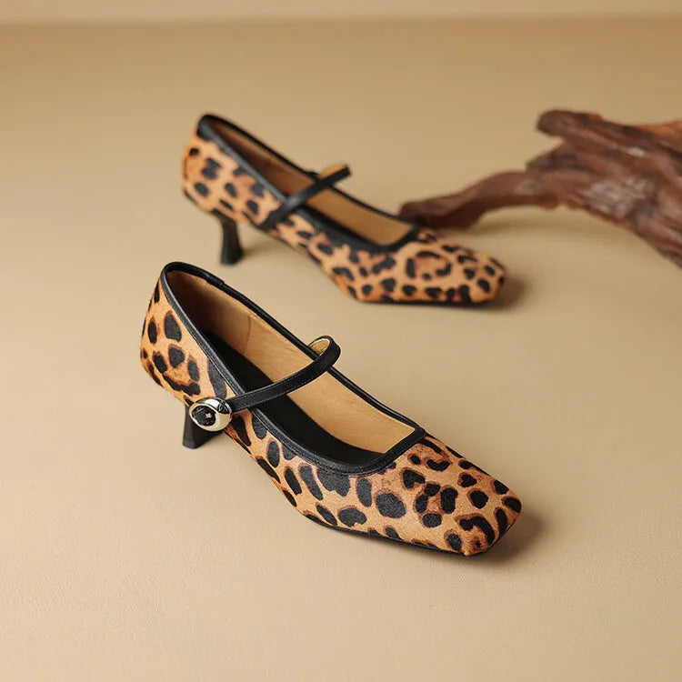 Women's black square toe stiletto ankle-strap shoes with horse hair upper and buckle fastening.