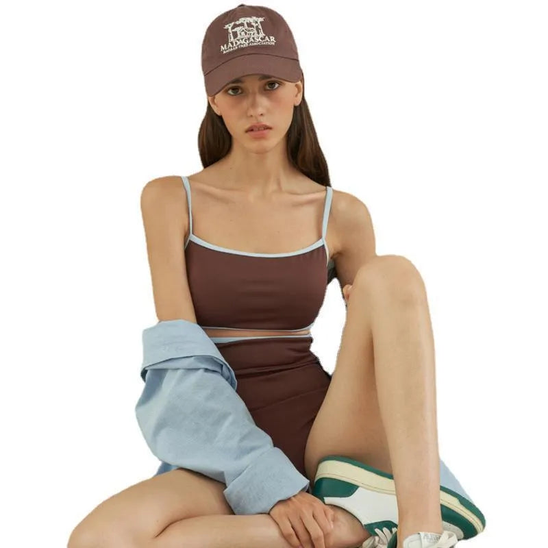 Brown triangle-style one-piece swimsuit for women on a mannequin.