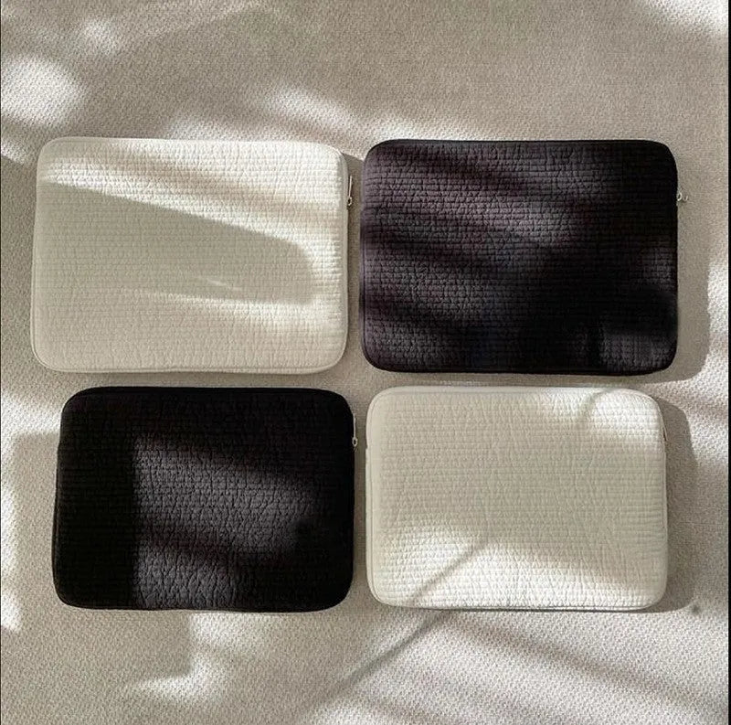 Black and white cotton cloth anti-seismic laptop sleeve or clutch bag for tablets, shown in three size options.