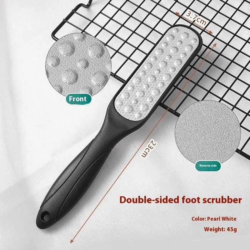 Double-sided stainless steel foot grinder with black and white grit attachments for callus removal