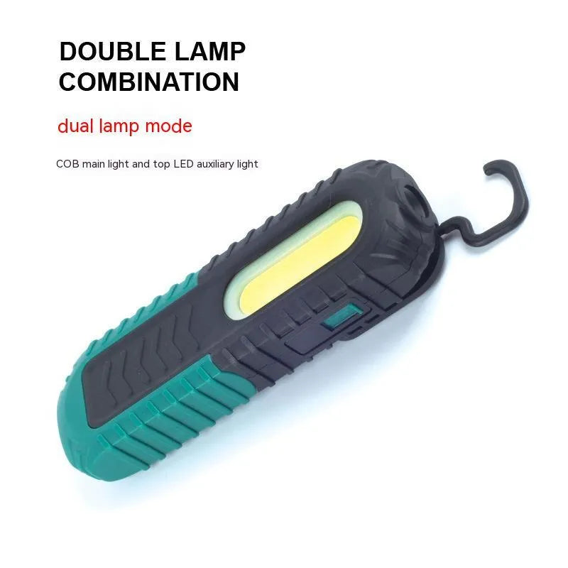 Black and green auto repair work light with USB charging cable