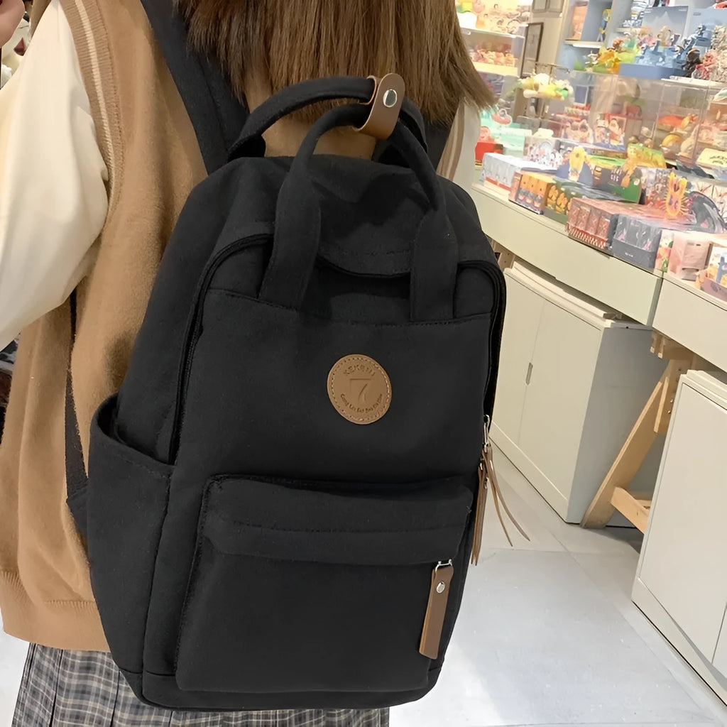 Black oxford cloth fashion backpack with curved shoulder straps and urban simplicity design