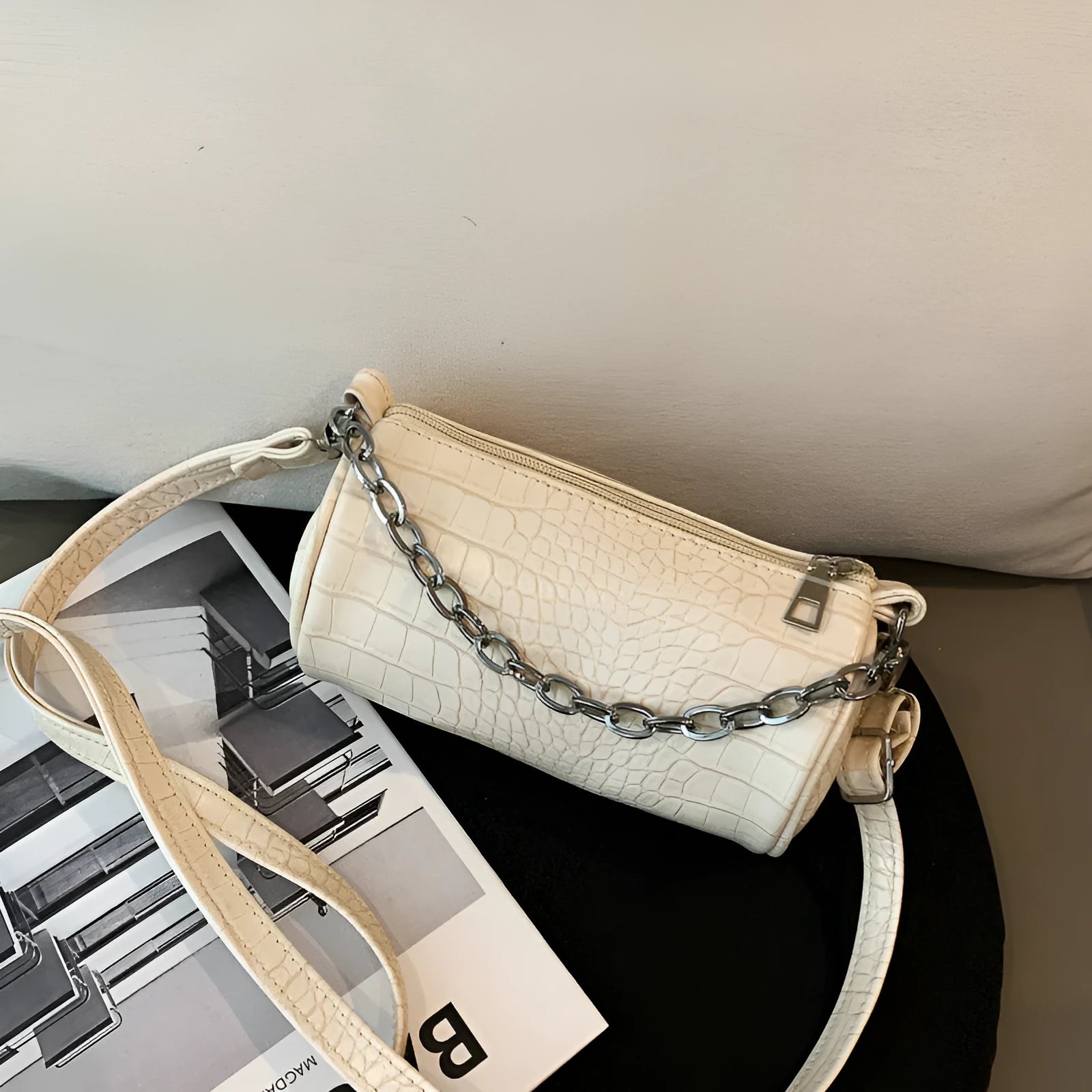 One shoulder cylinder messenger bag in beige PU leather with embossed crocodile pattern and zipper closure