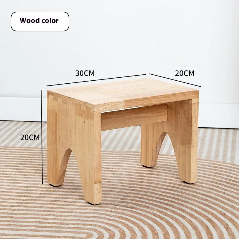 Distressed solid wood changing stool with bracket structure for hallway or living room.