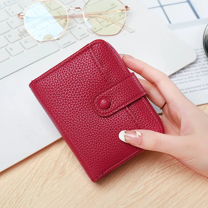 Ladies short wallet with lychee pattern in two-fold design showing four colour options