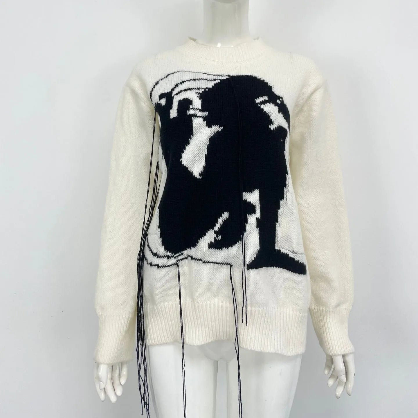 Women's loose Alpaca wool sweater with tassel design and abstract pattern in grey colour