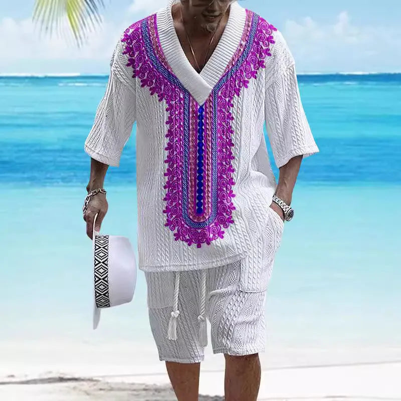 Man wearing a grey printed knitted short-sleeved top with drop shoulders and matching shorts, a casual two-piece suit set.