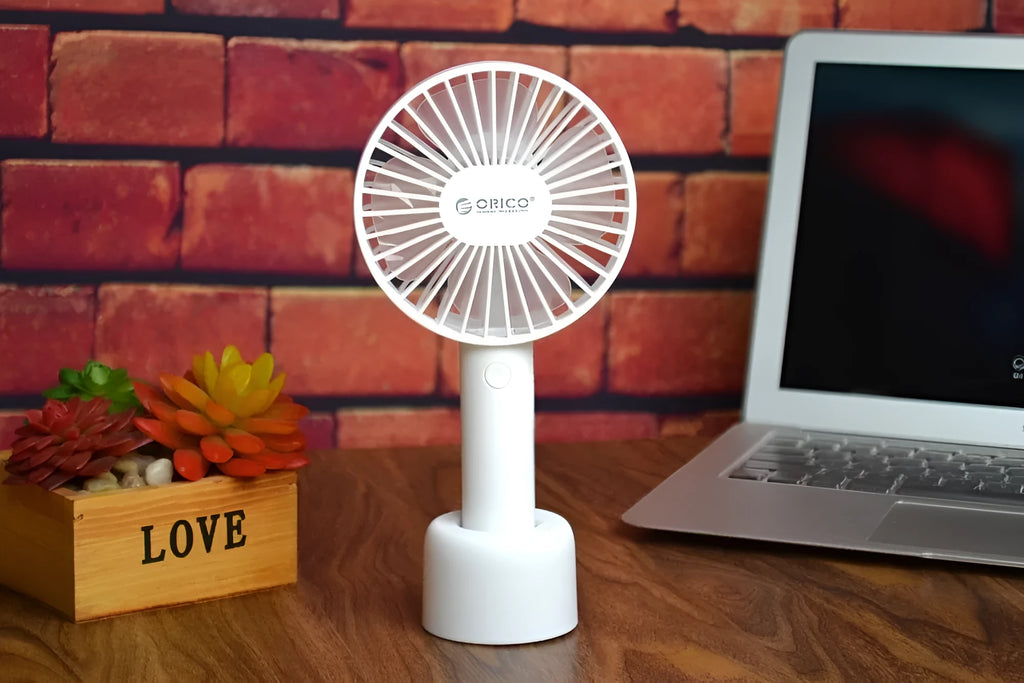 ORICO FH1 white portable USB rechargeable fan with adjustable speed settings and handheld design