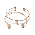 Women's gold vintage cuff bracelet with knotted arrow design in alloy with electroplated finish