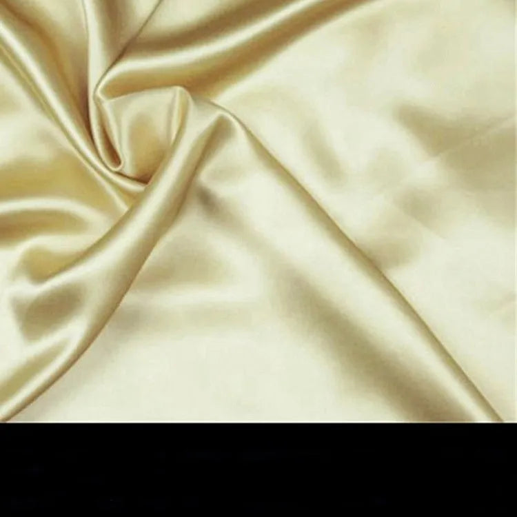 Double-sided 19 M silk pillowcase in apricot colour, showing smooth satin weave texture.