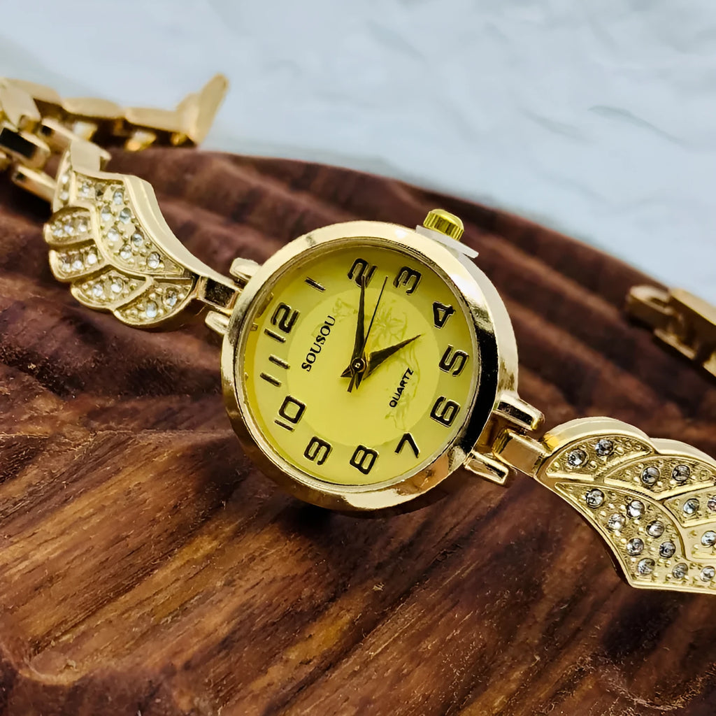 Women's stainless steel watch with round dial showing gold face colour option