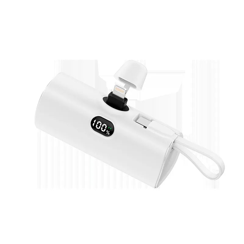 Compact capsule-shaped power bank with digital display and wireless charging surface in multiple colour options