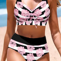 Black women's bikini with printed design, belly coverage and split leg style for swimming.