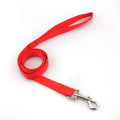 Solid colour nylon dog walking leash in blue held in a hand, showing the single rope design and hand loop.