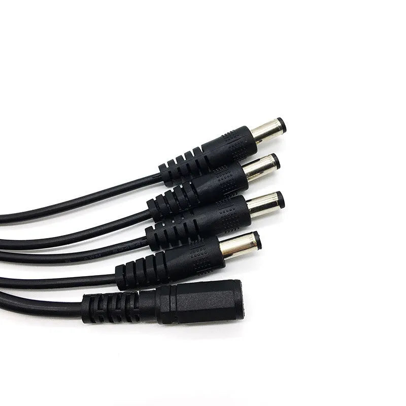 Black 12V DC monitoring power cord with one input and four output connectors for CCTV cameras