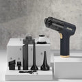 Black wireless handheld vacuum cleaner with tyre inflator and multiple nozzle attachments