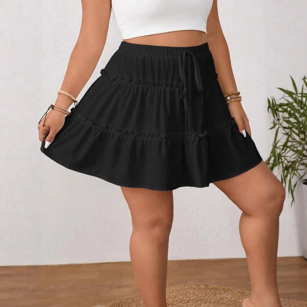 White women's pleated A-line mini skirt with adjustable lace-up detail